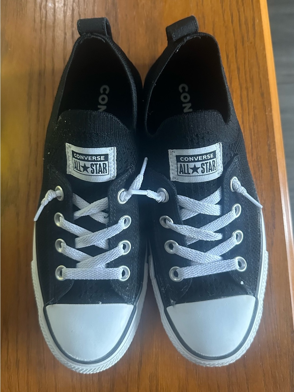 Converse woman’s Black & White Low-Top Slip-On Sneakers